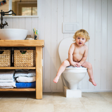 cute-toddler-boy-sitting-on-the-toilet-in-the-bath-2021-08-26-12-08-51-utc